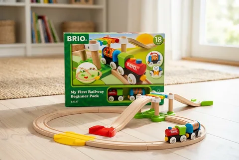 BRIO My First Railway beginner set with wooden track, bridge, and a two-car train on a wood floor