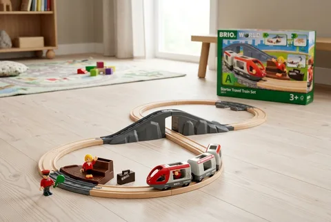 BRIO World Starter Travel Train Set box beside an assembled figure-8 wooden track with a red passenger train