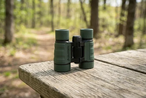 Celestron Kids 4x30 Roof Binocular with green rubber-armored body and center focus wheel