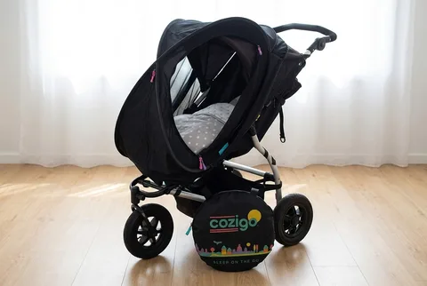CoziGo Sleep Easy Bassinet and Stroller Cover fitted over a stroller with mesh windows visible