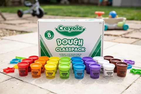 Large set of colorful modeling dough cups for supervised toddler and preschool play