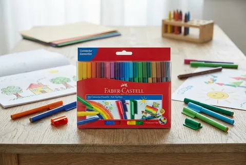 Faber-Castell Connector pens 20-count wallet on a wooden desk with loose pens and kids drawings
