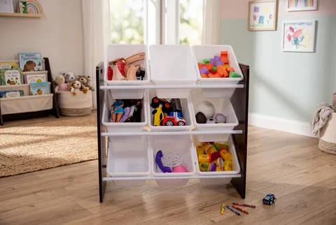 Espresso Humble Crew organizer with nine white bins of toys on a wooden playroom floor