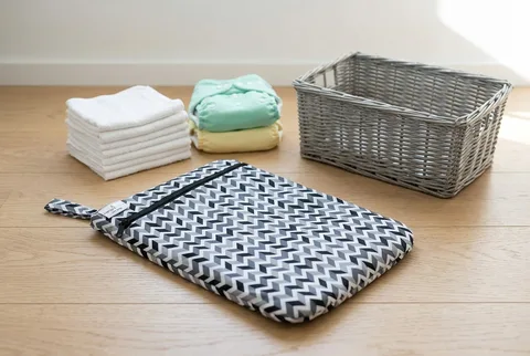 Kanga Care Wet Bag in Zev print, showing the large zippered waterproof pouch design.