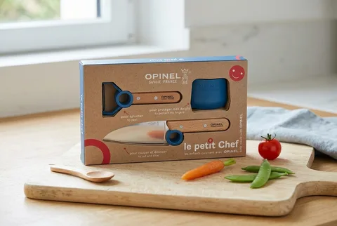 Finger guard and supervised kids kitchen prep tools near sliced produce