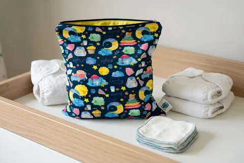 Planet Wise Medium Wet Bag in Sleepy Dust print, showing the rectangular zippered design.
