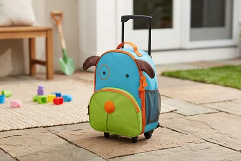 Small pastel preschool rolling suitcase with four wheels