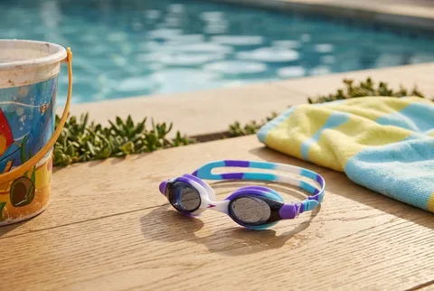Standard kids swim lesson goggles with clear lenses and an adjustable strap