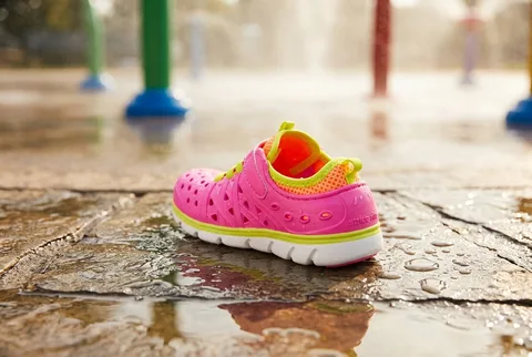 Sneaker-like kids water shoe with mesh panels and quick-toggle laces