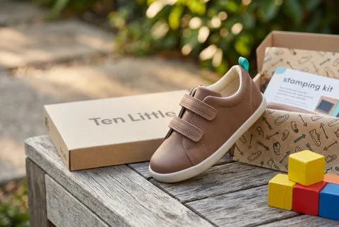 Ten Little Everyday Original mocha brown sneakers on a woven entryway mat